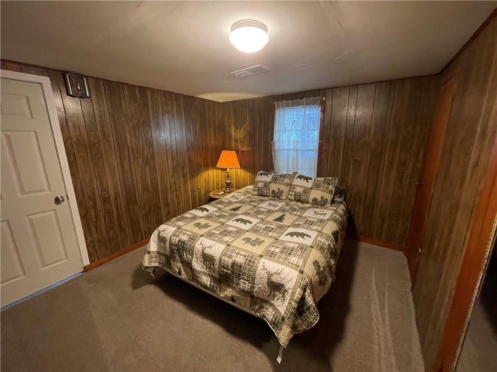 71 McGuire Road Dallas, GA 30157 - Photo 6 of 26 a bed sitting in a spacious bedroom next to a window