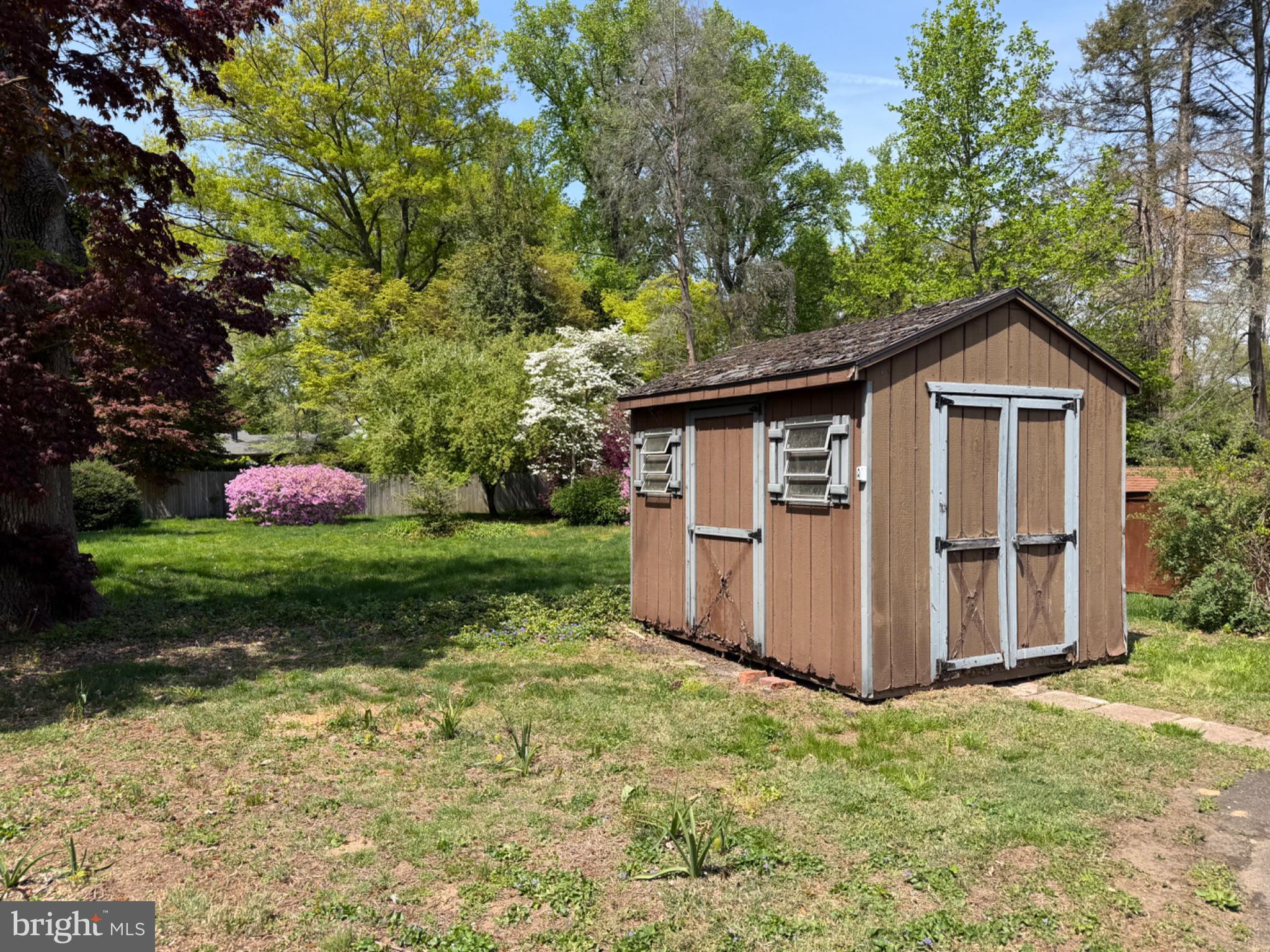 74 Black Rock Road Yardley, PA 19067 - Photo 21 of 21 Charming garden shed in lush greenery.