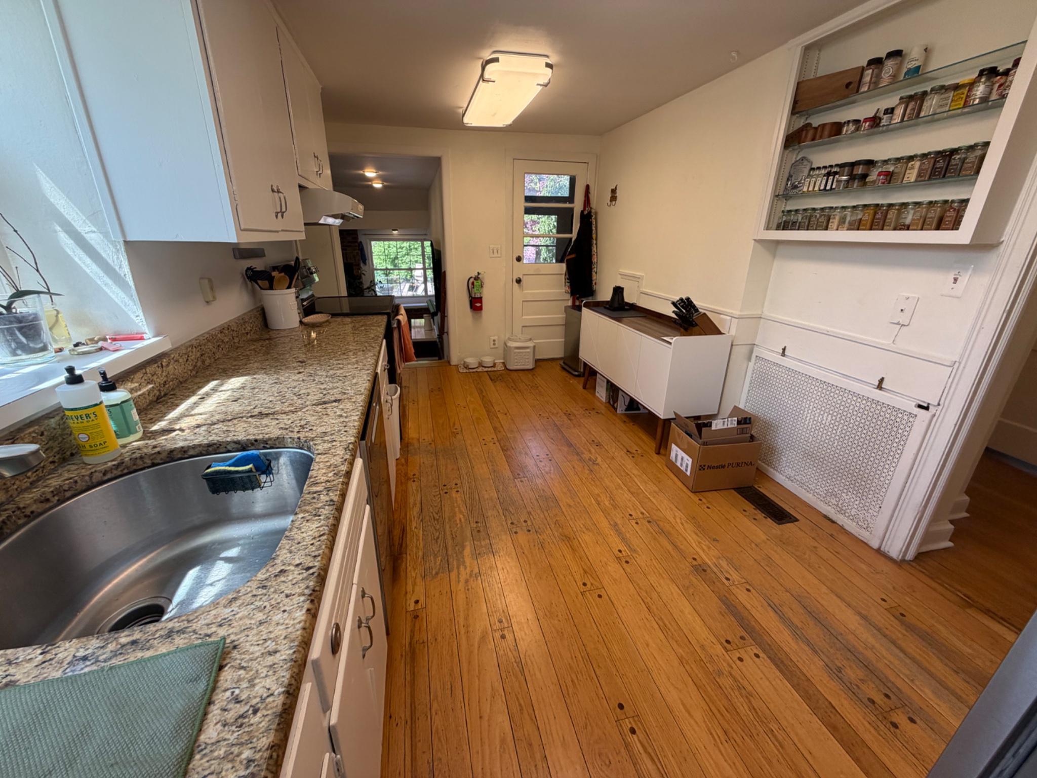 74 Black Rock Road Yardley, PA 19067 - Photo 8 of 21 Spacious galley kitchen with warm wood floors.