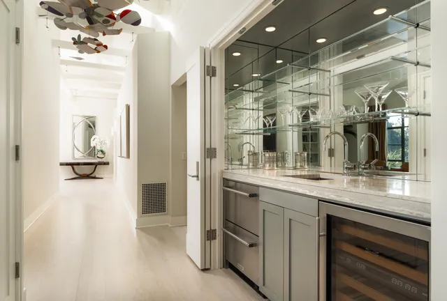 a view of a house with a yard and potted plants