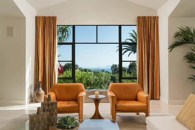 a view of a dining room with furniture window and outside view