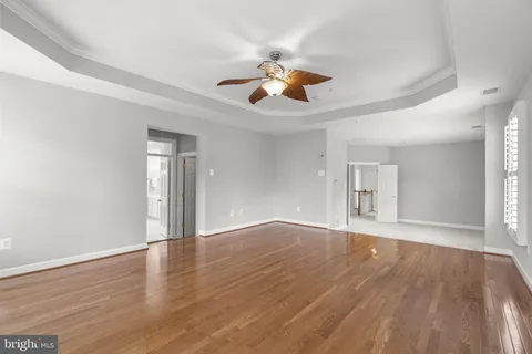 an empty room with a ceiling fan