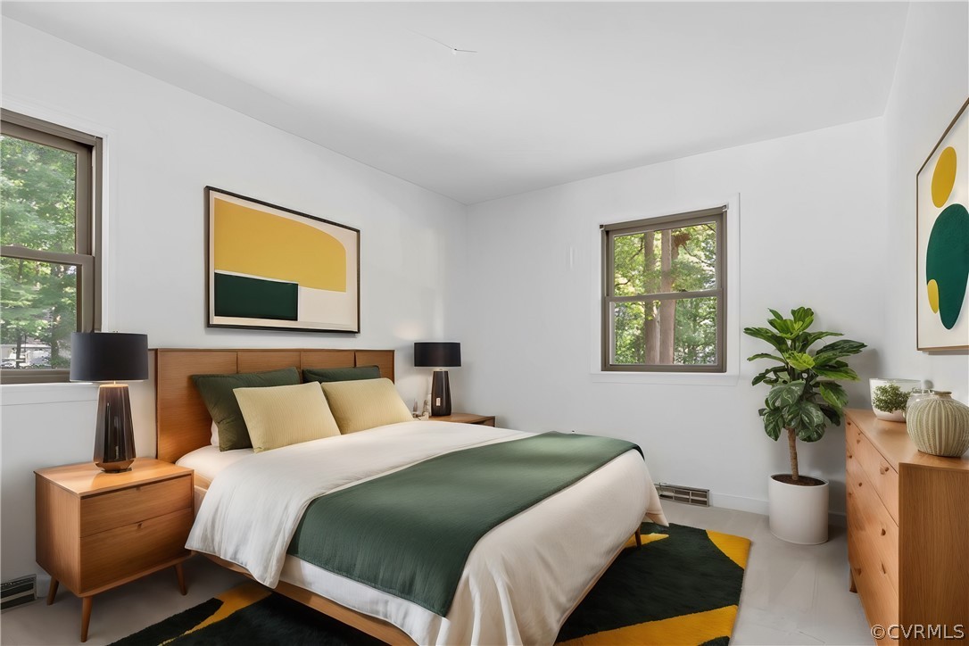 13919 Barnes Spring Road Midlothian, VA 23112 - Photo 14 of 25 a bedroom with a bed and a potted plant