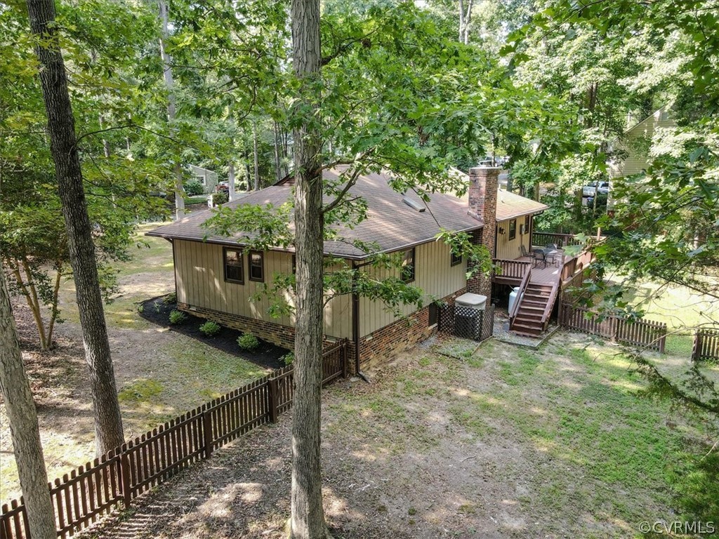 13919 Barnes Spring Road Midlothian, VA 23112 - Photo 20 of 25 a view of a house with backyard and sitting area