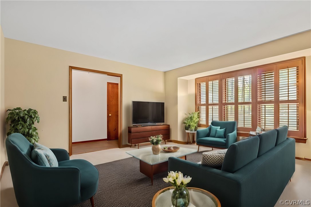 13919 Barnes Spring Road Midlothian, VA 23112 - Photo 2 of 25 a living room with furniture potted plant and a large window