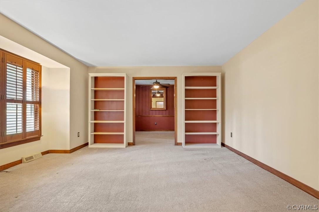13919 Barnes Spring Road Midlothian, VA 23112 - Photo 9 of 25 an empty room with a closet and cabinet