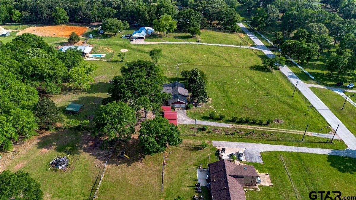 8192 County Road 428 Tyler, TX 75704 - Photo 34 of 38 a view of a tennis ground and large trees