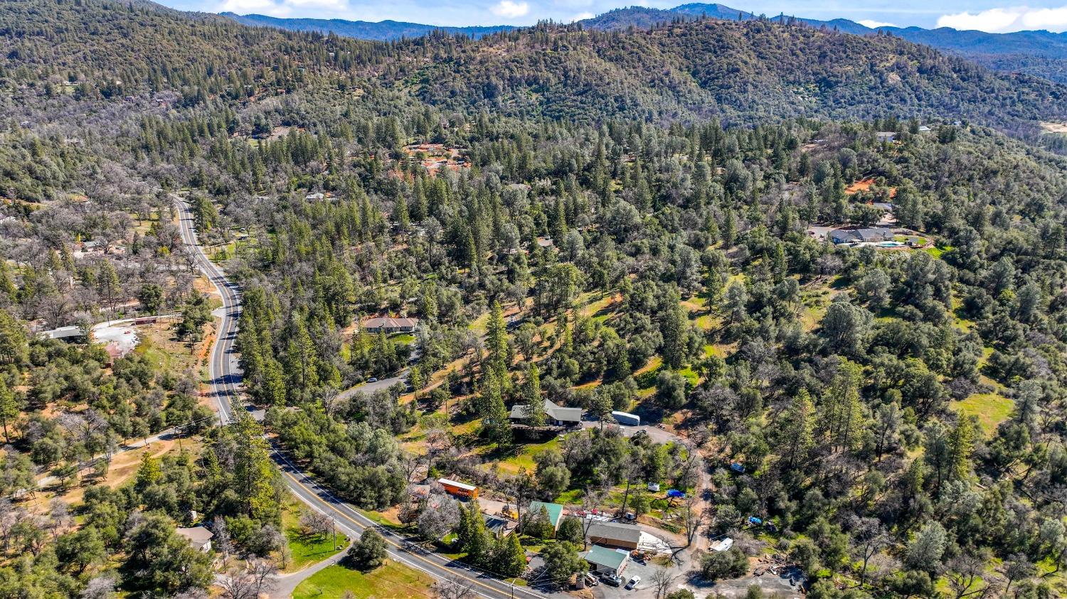 20275 Tuolumne Road North Tuolumne, CA 95379 - Photo 35 of 58 an aerial view of house with yard and mountain view in back