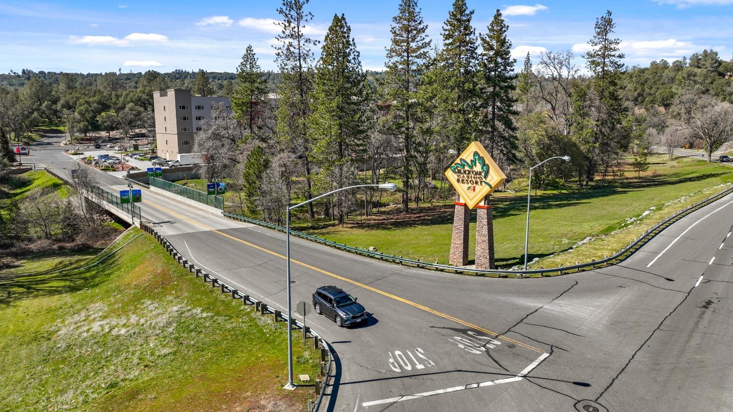 20275 Tuolumne Road North Tuolumne, CA 95379 - Photo 47 of 58 a view of a swimming pool with a patio and lake view