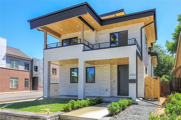 aerial view of a house with a yard