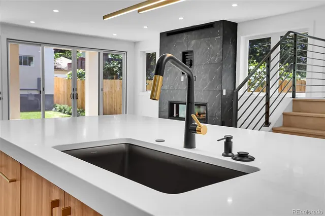 a kitchen with a sink and a refrigerator