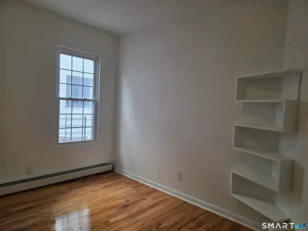 a view of an empty room with a window