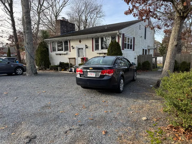 a car parked in front of a house