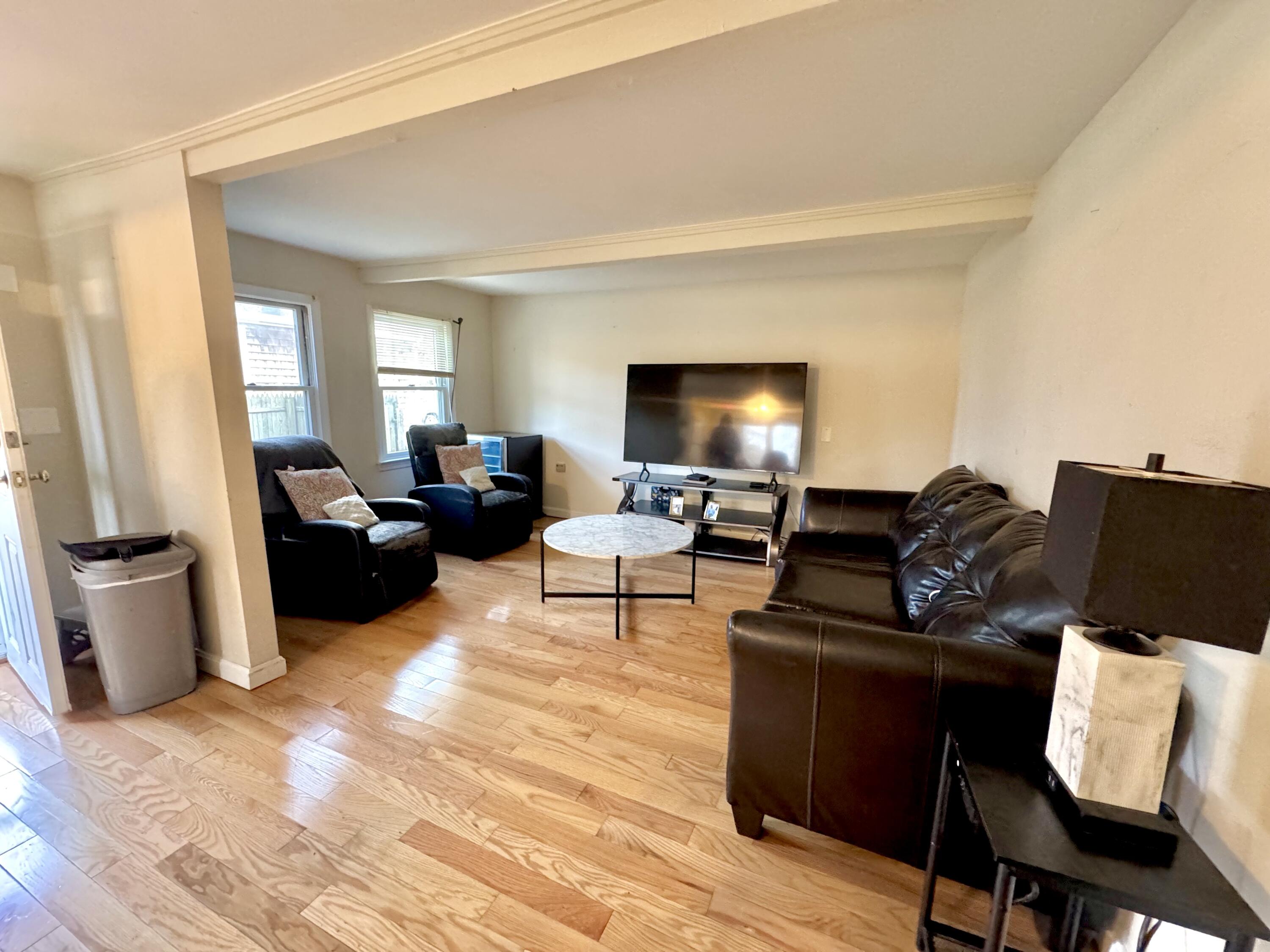 299 Winslow Gray Road West Yarmouth, MA 02673 - Photo 13 of 19 a living room with furniture and a flat screen tv
