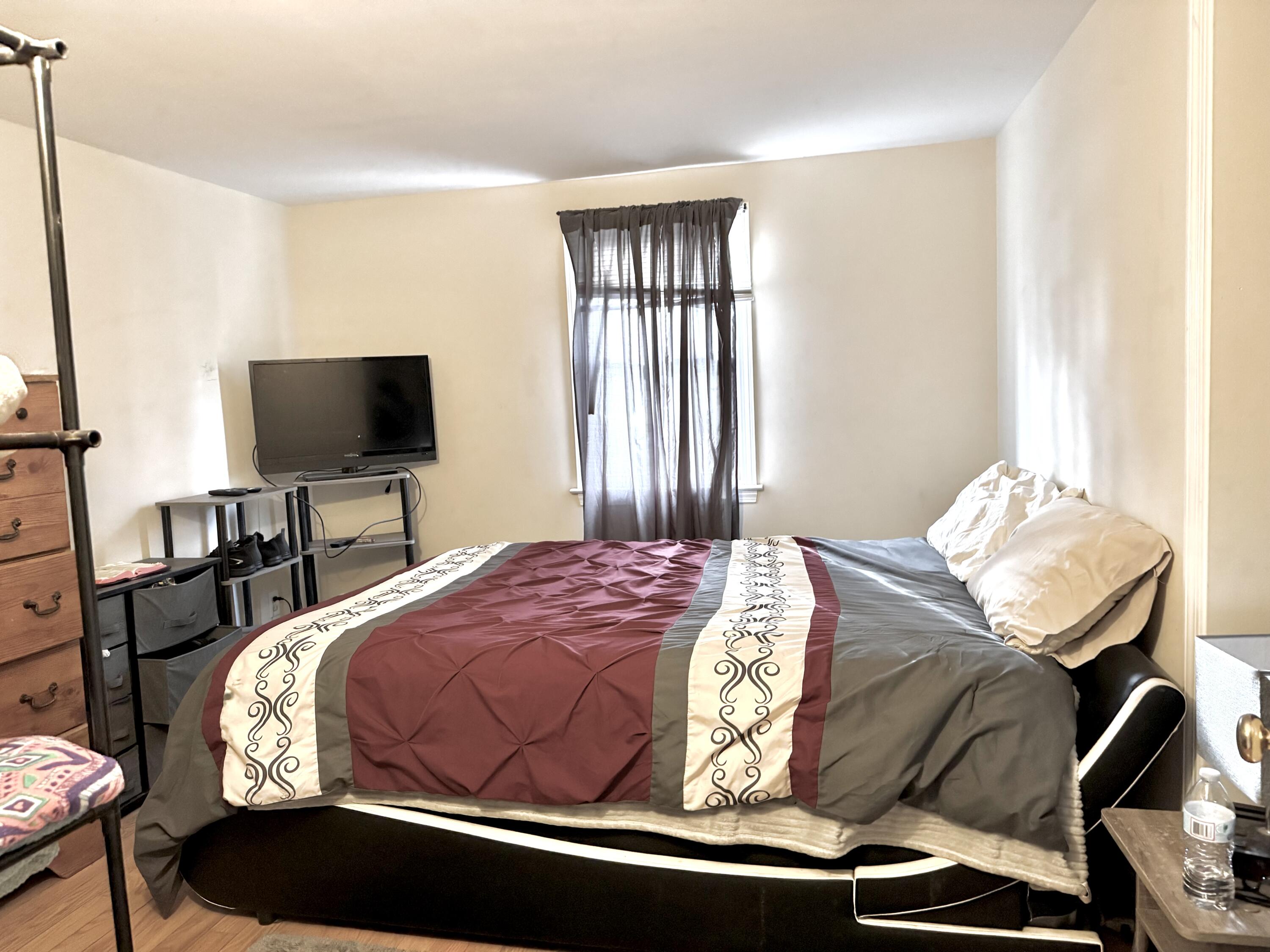 299 Winslow Gray Road West Yarmouth, MA 02673 - Photo 15 of 19 a bedroom with a bed and tv