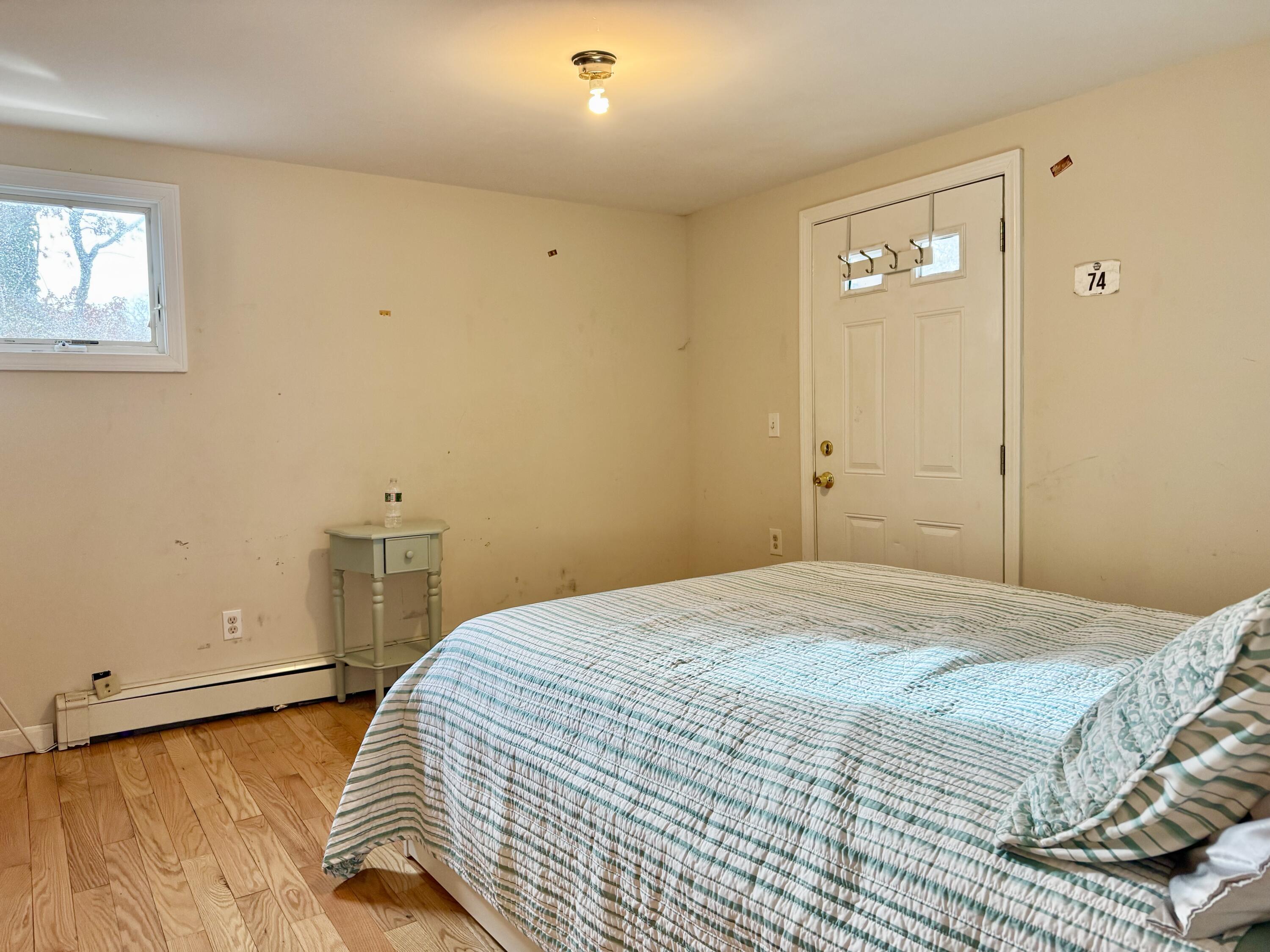 299 Winslow Gray Road West Yarmouth, MA 02673 - Photo 16 of 19 a bedroom with a bed and a window