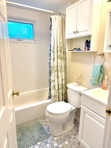 a bathroom with a sink a toilet and a bathtub
