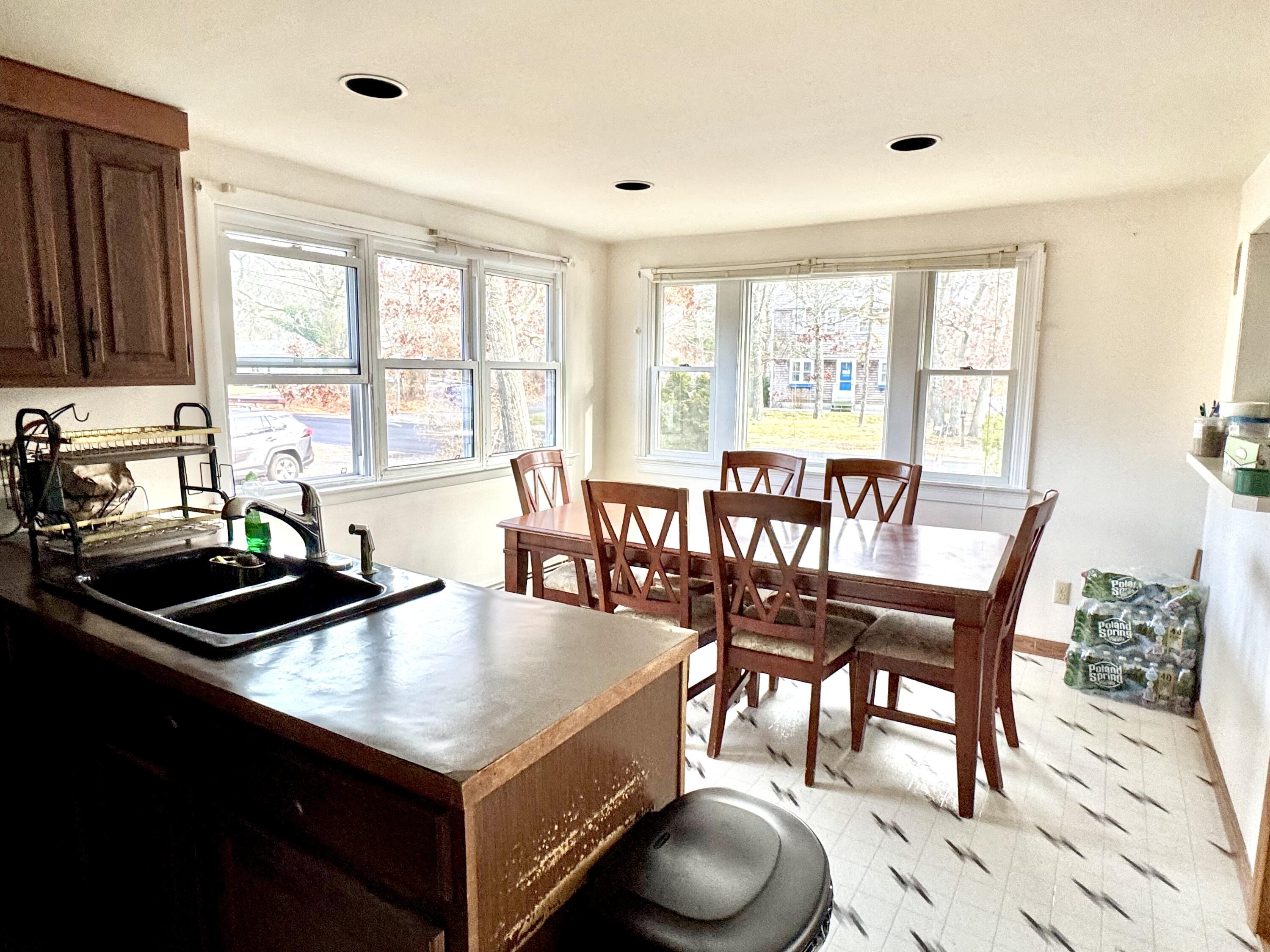 299 Winslow Gray Road West Yarmouth, MA 02673 - Photo 4 of 19 a view of a dining room with furniture window and outside view