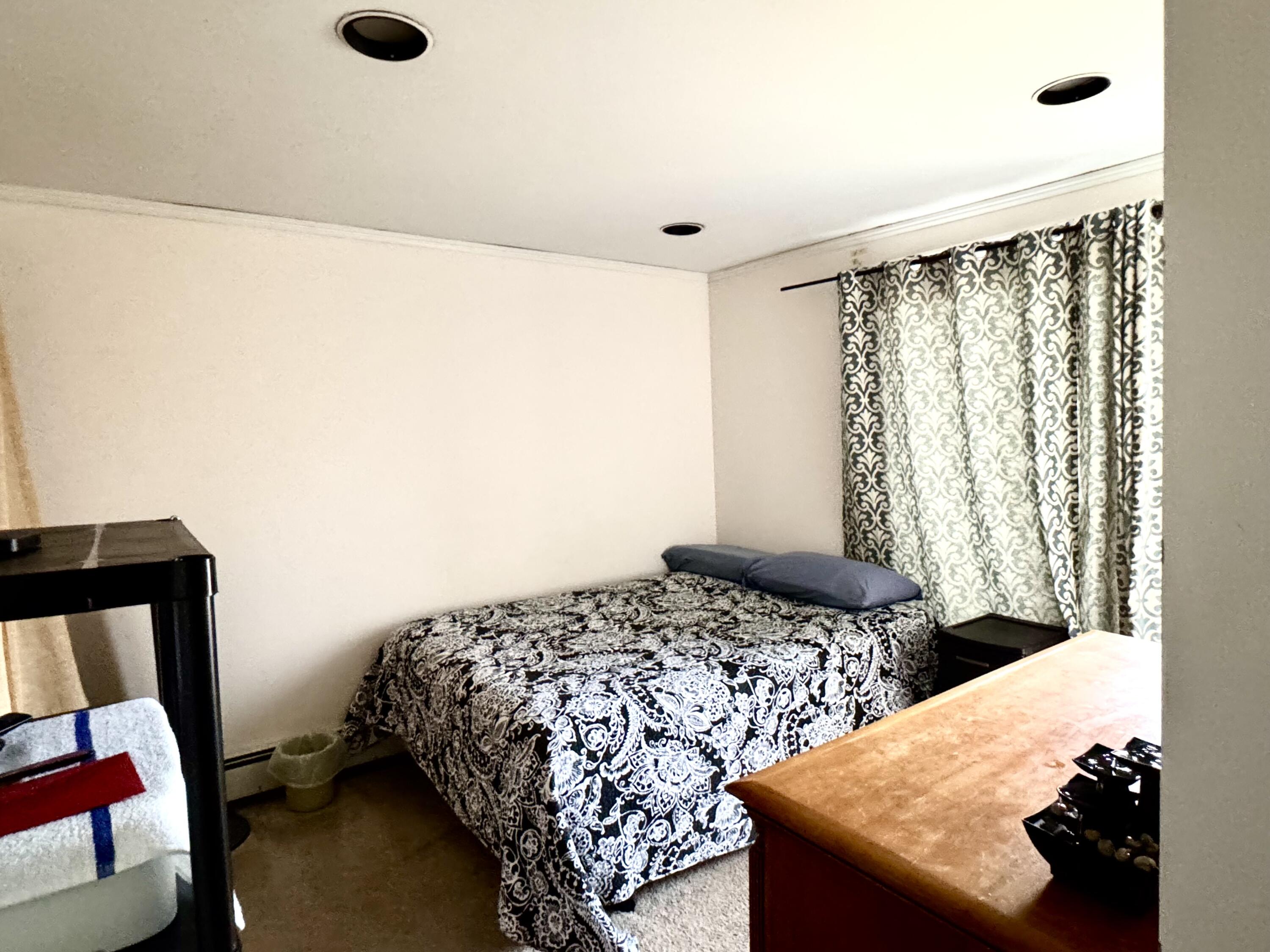 299 Winslow Gray Road West Yarmouth, MA 02673 - Photo 9 of 19 a bedroom with a bed and a window