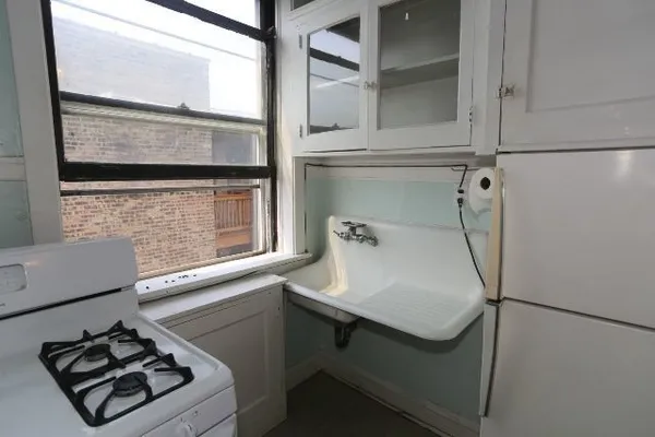 a bathroom with a sink and a window