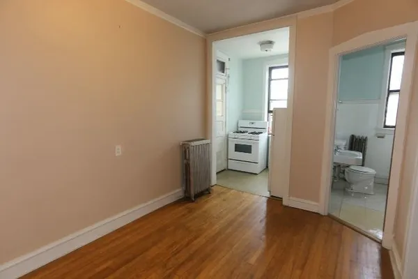 a view of a kitchen from the hallway