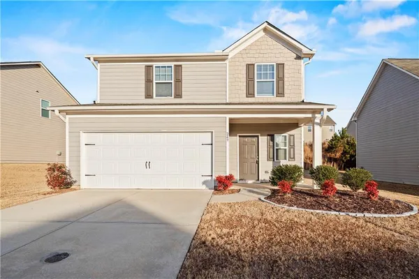 front view of a house with a yard
