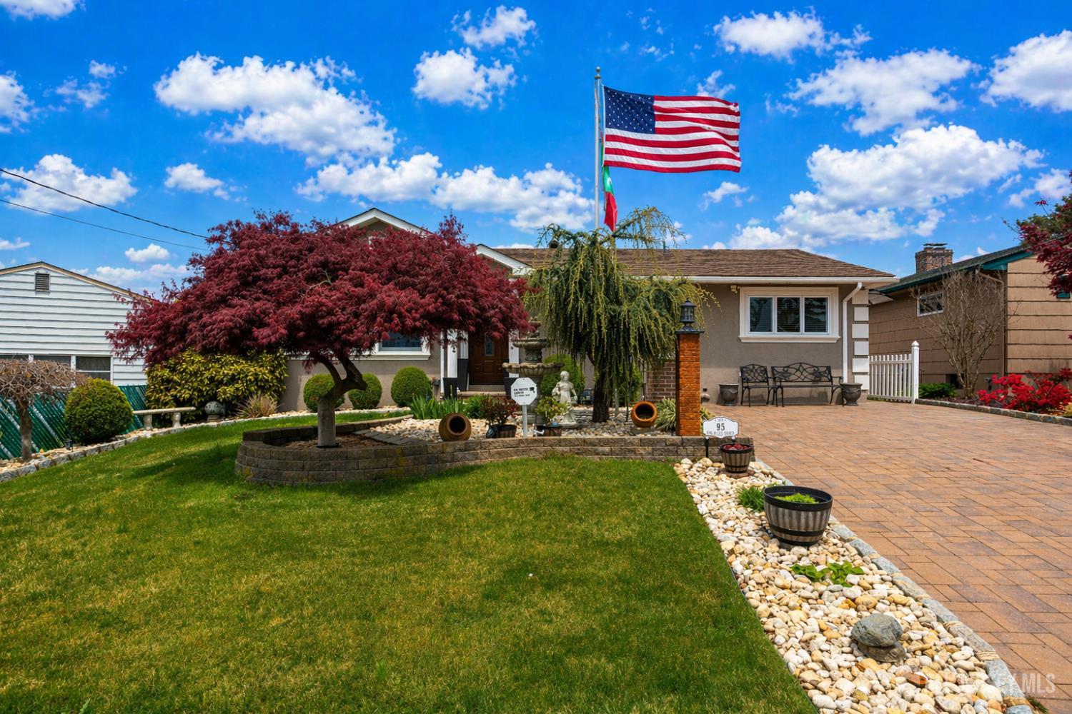 95 Pinetree Drive Sayreville, NJ 08859 - Photo 2 of 12 a house view with a sitting space and garden