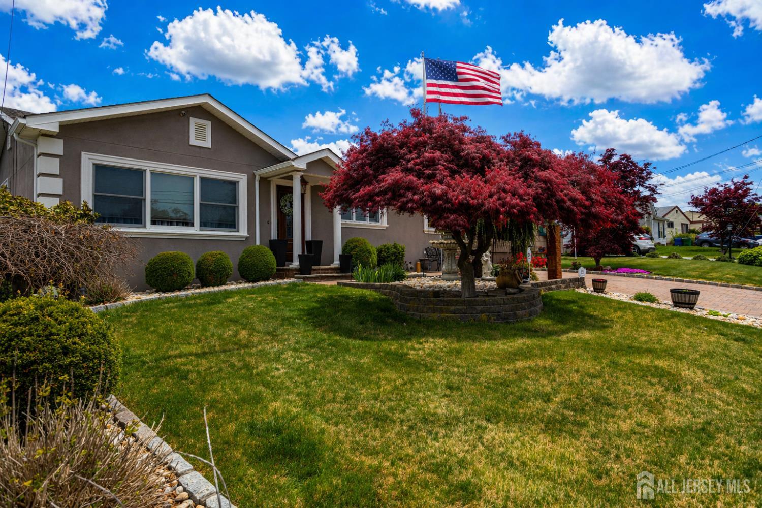 95 Pinetree Drive Sayreville, NJ 08859 - Photo 3 of 12 a front view of a house with a yard