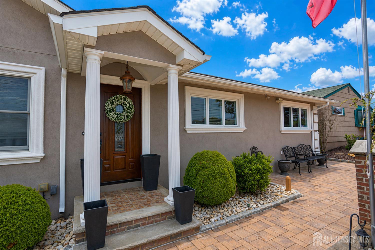 95 Pinetree Drive Sayreville, NJ 08859 - Photo 4 of 12 a view of a house with potted plants
