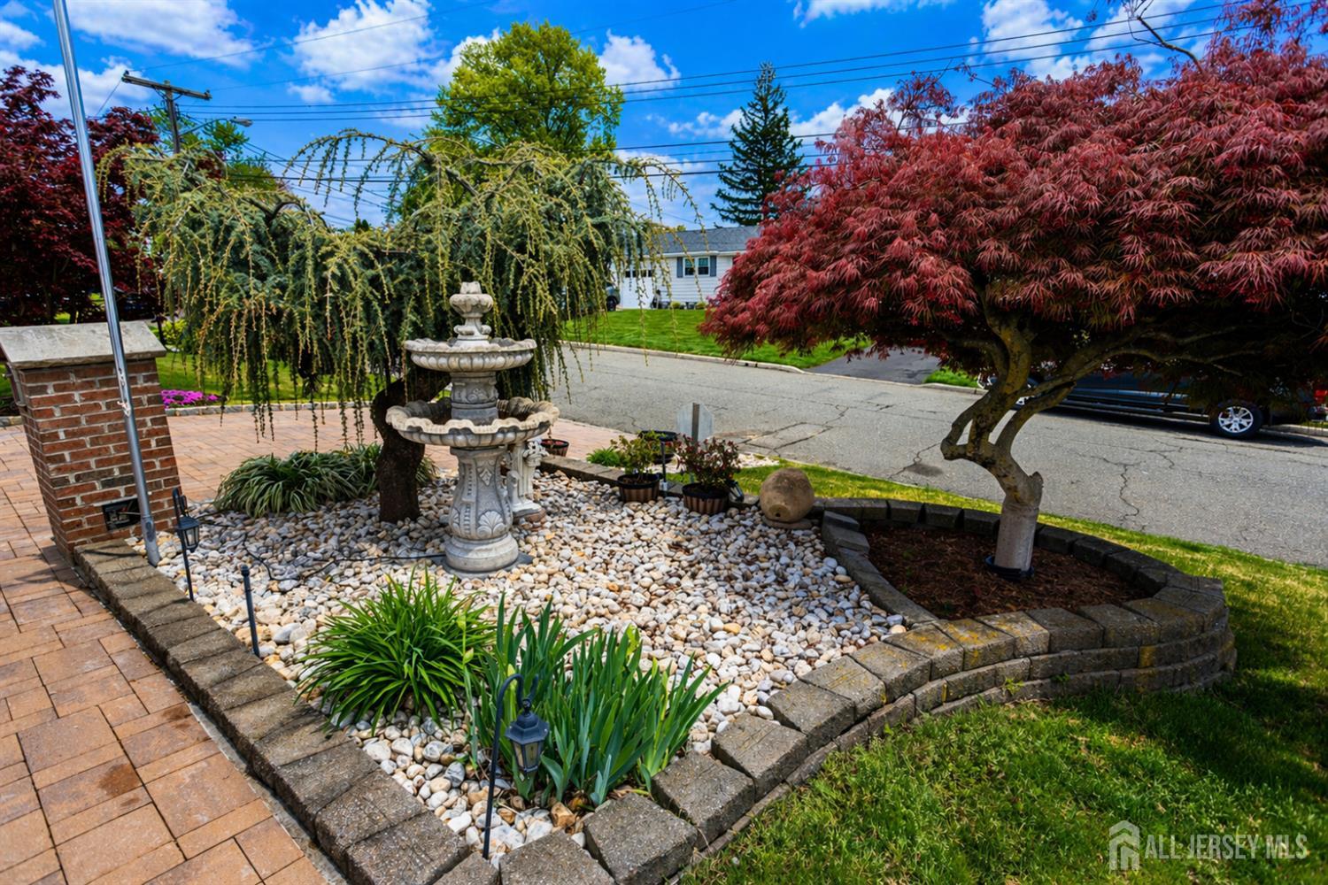 95 Pinetree Drive Sayreville, NJ 08859 - Photo 5 of 12 a view of a garden with sitting area