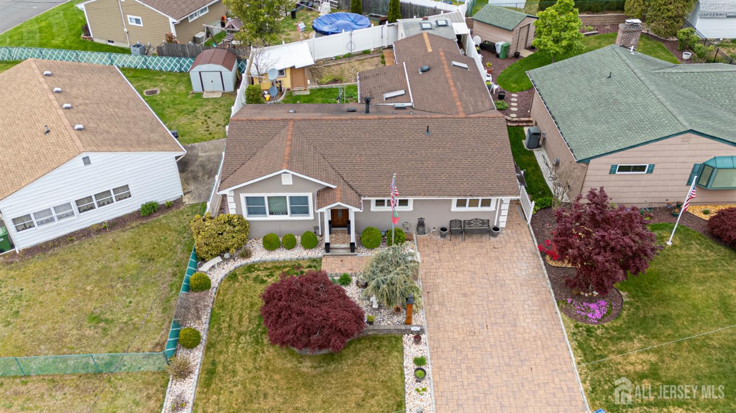 95 Pinetree Drive Sayreville, NJ 08859 - Photo 6 of 12 an aerial view of a house with a yard basket ball court and outdoor seating