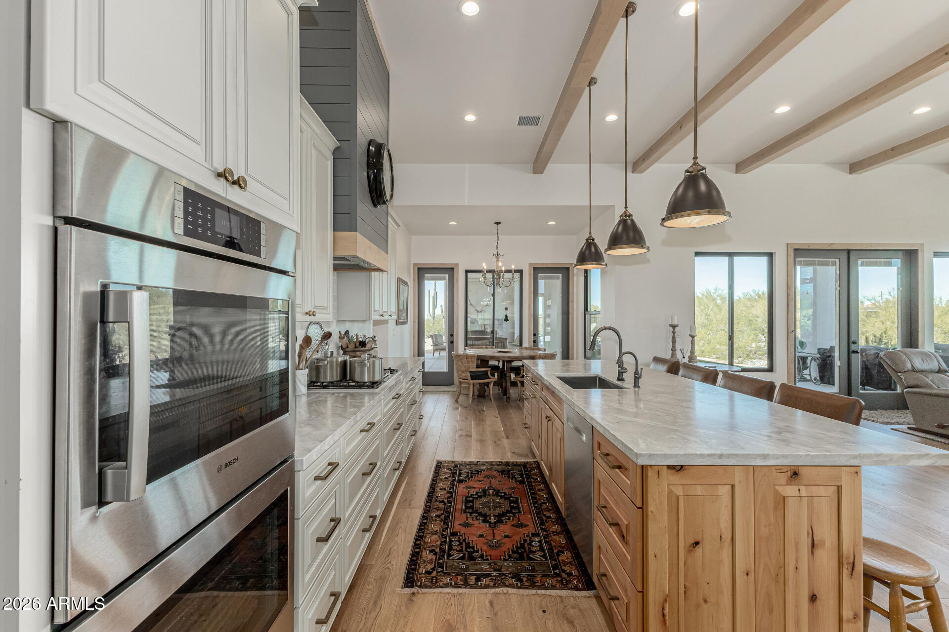 31210 North 68th Street Cave Creek, AZ 85331 - Photo 19 of 61 a large kitchen with stainless steel appliances lots of counter space and a refrigerator