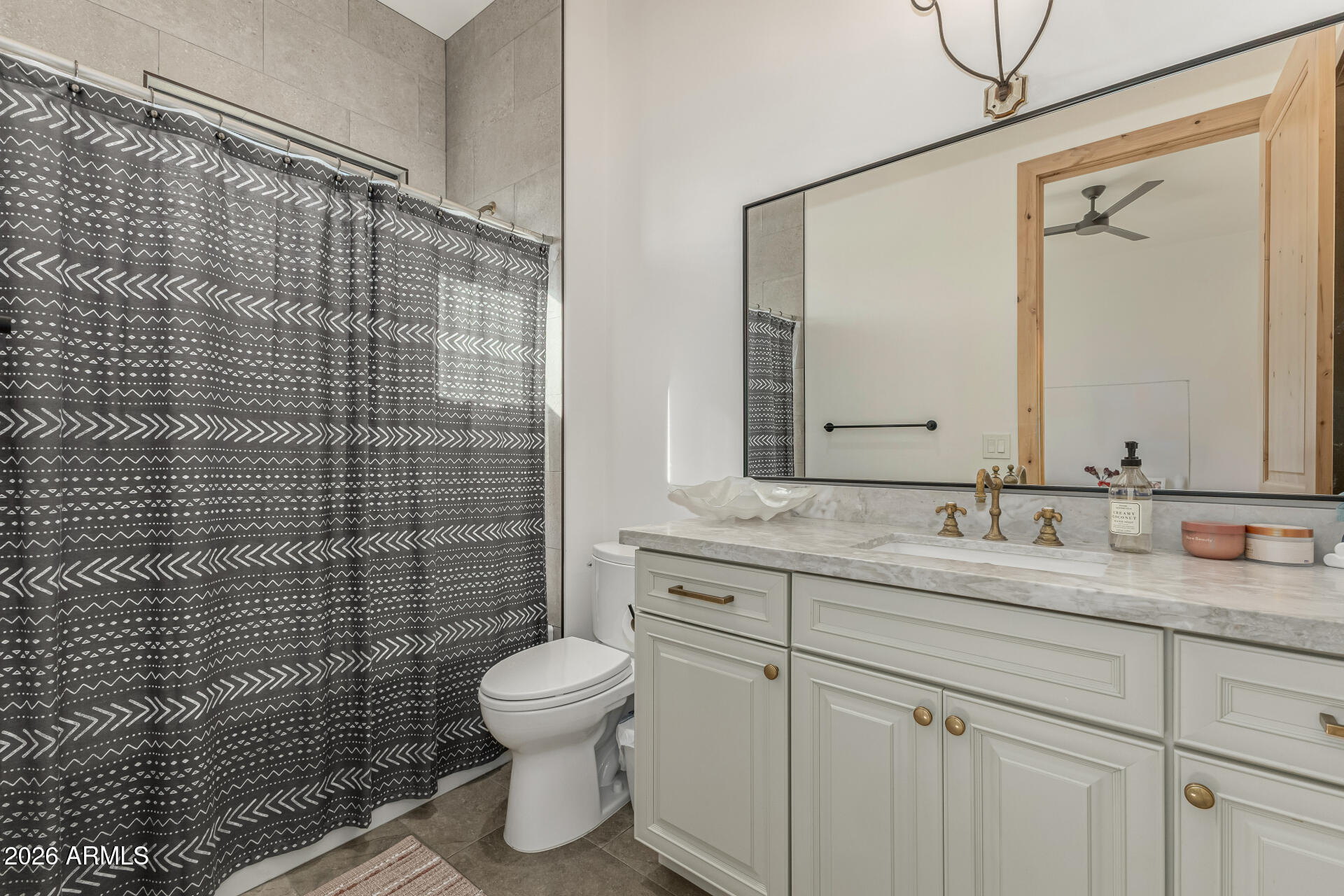 31210 North 68th Street Cave Creek, AZ 85331 - Photo 29 of 61 a bathroom with a granite countertop toilet sink and mirror