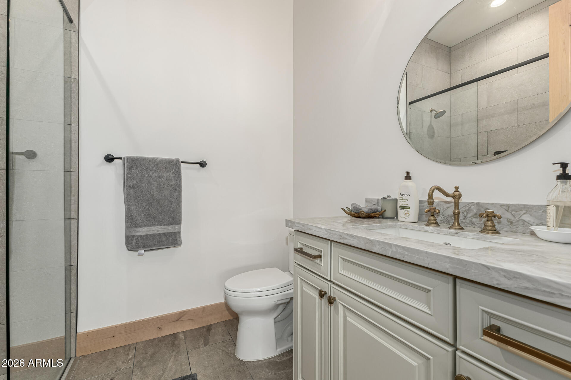 31210 North 68th Street Cave Creek, AZ 85331 - Photo 32 of 61 a bathroom with a granite countertop toilet sink mirror and vanity