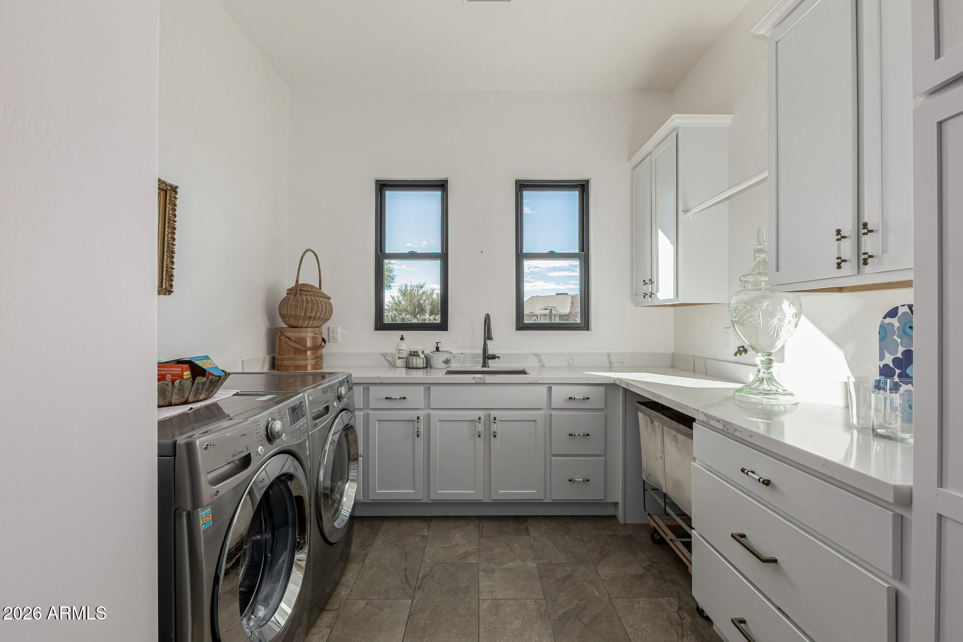 31210 North 68th Street Cave Creek, AZ 85331 - Photo 34 of 61 a kitchen that has a sink and a stove in it