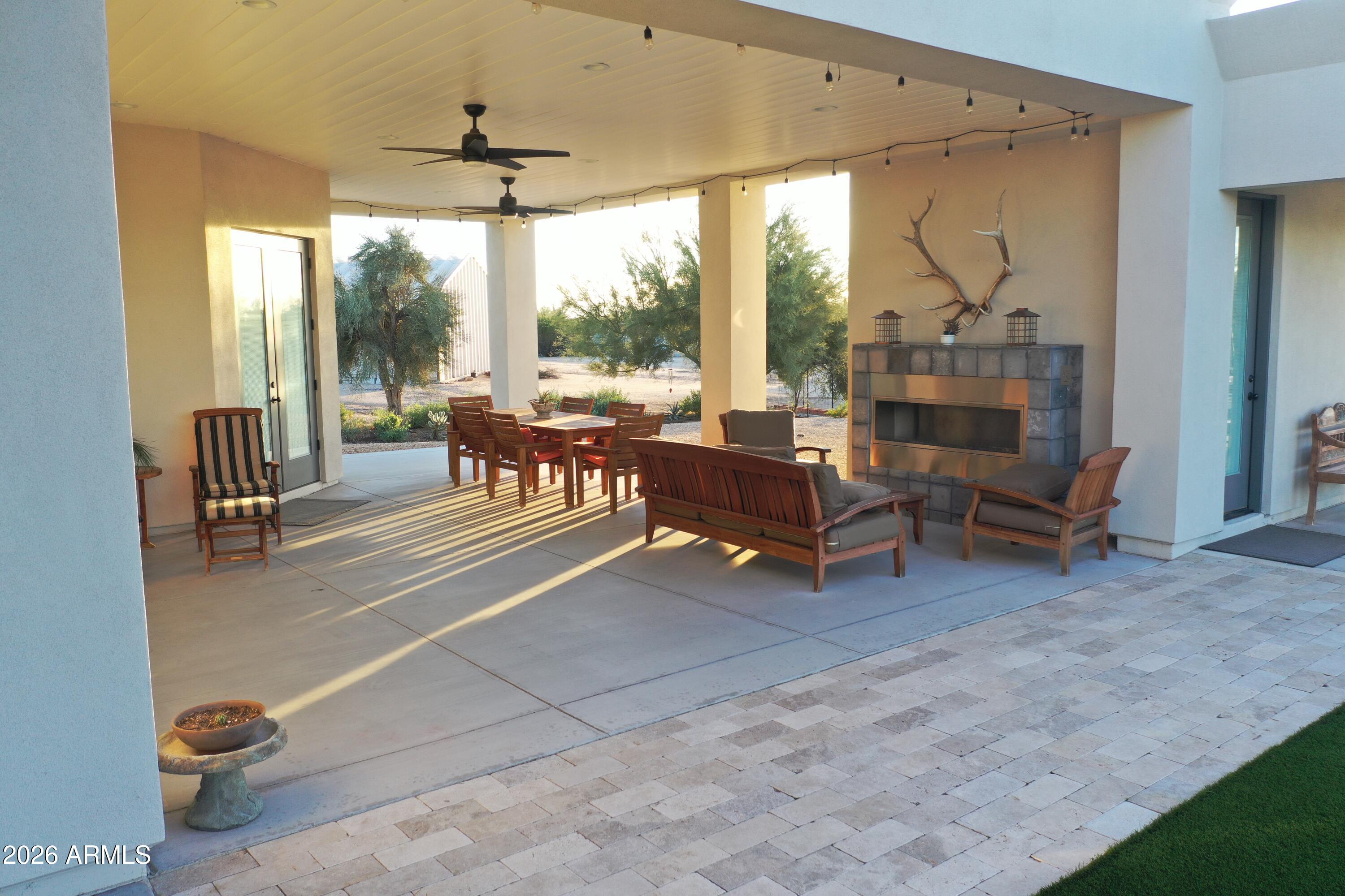 31210 North 68th Street Cave Creek, AZ 85331 - Photo 39 of 61 a living room with furniture and a floor to ceiling window