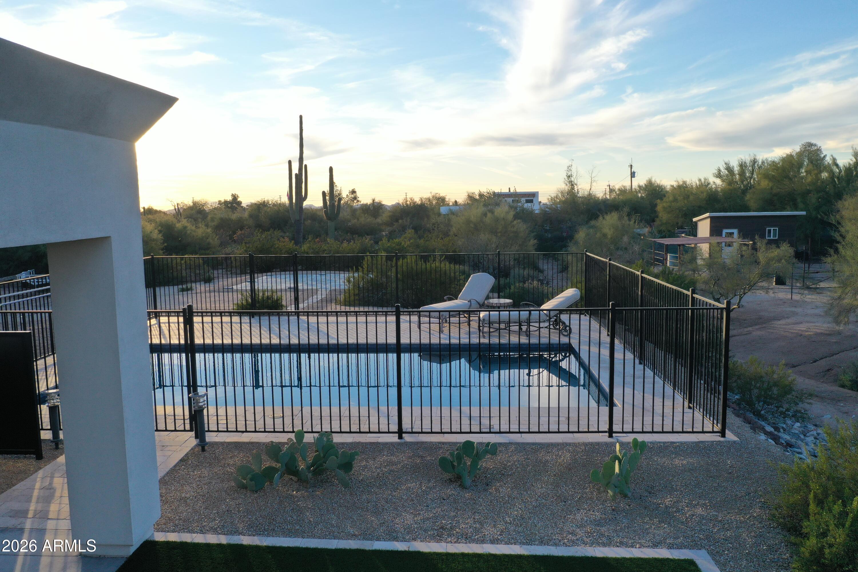 31210 North 68th Street Cave Creek, AZ 85331 - Photo 50 of 61 a view of a roof deck with wooden fence and floor