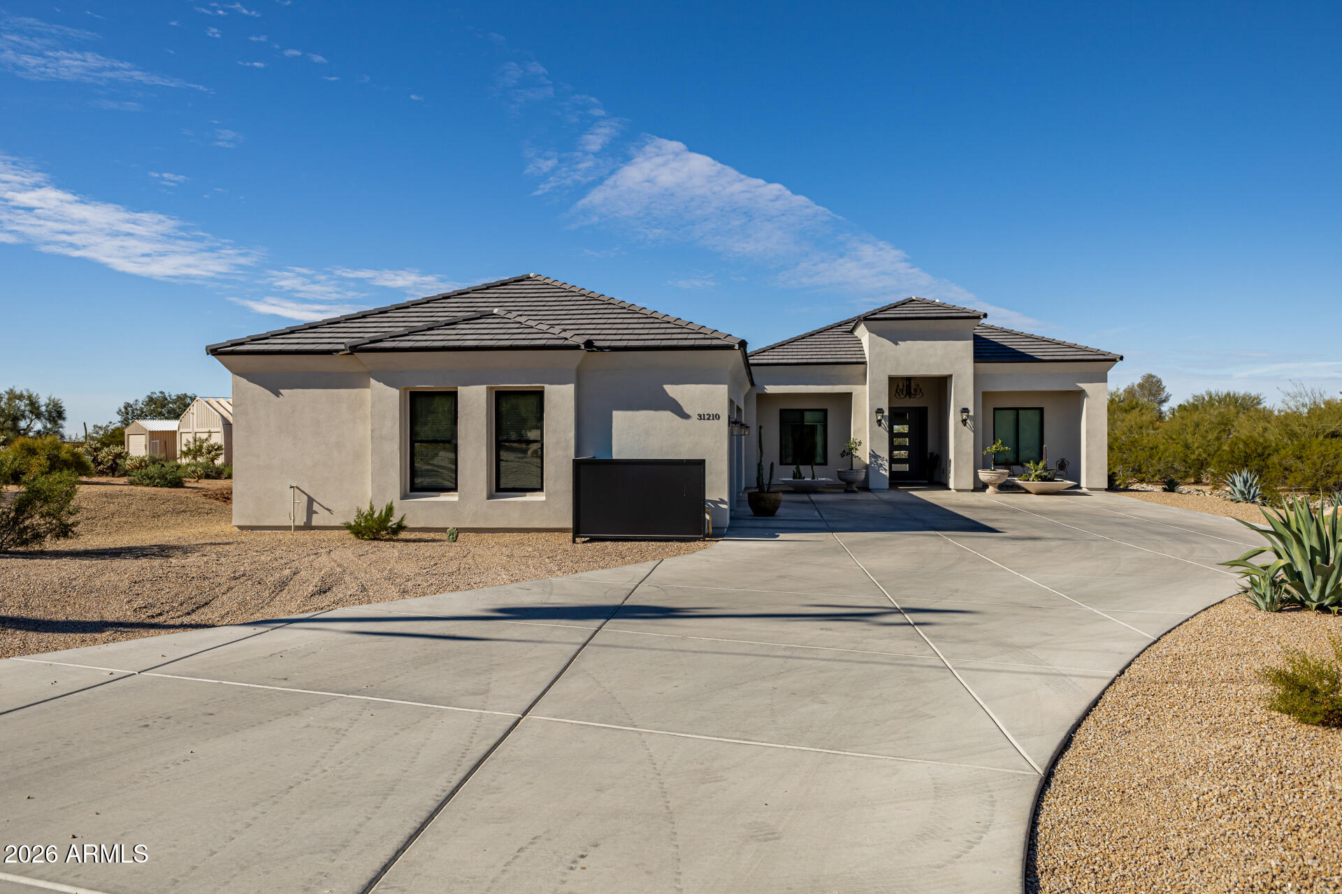 31210 North 68th Street Cave Creek, AZ 85331 - Photo 5 of 61 a front view of a house with a yard