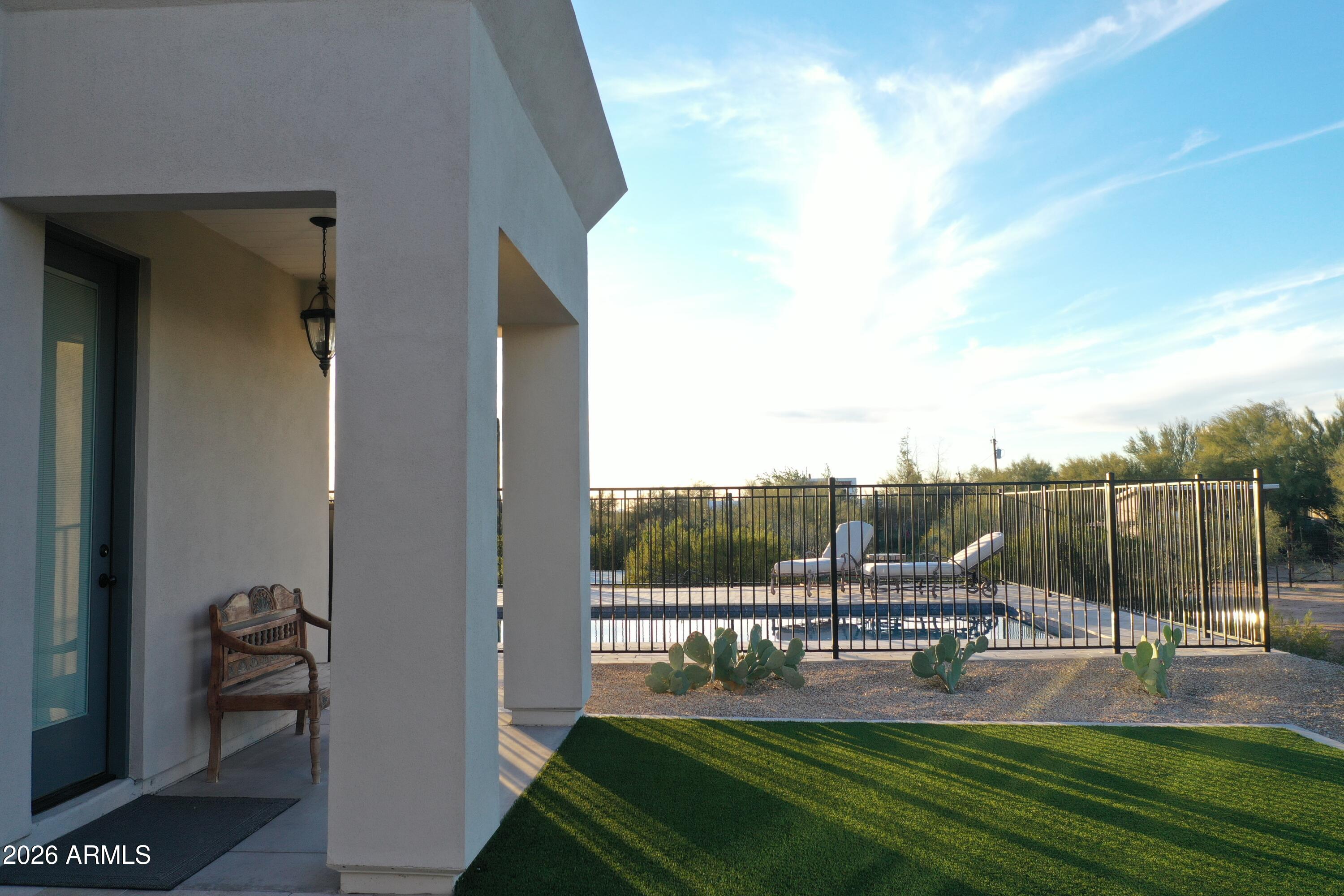 31210 North 68th Street Cave Creek, AZ 85331 - Photo 53 of 61 a swimming pool with outdoor seating and garden