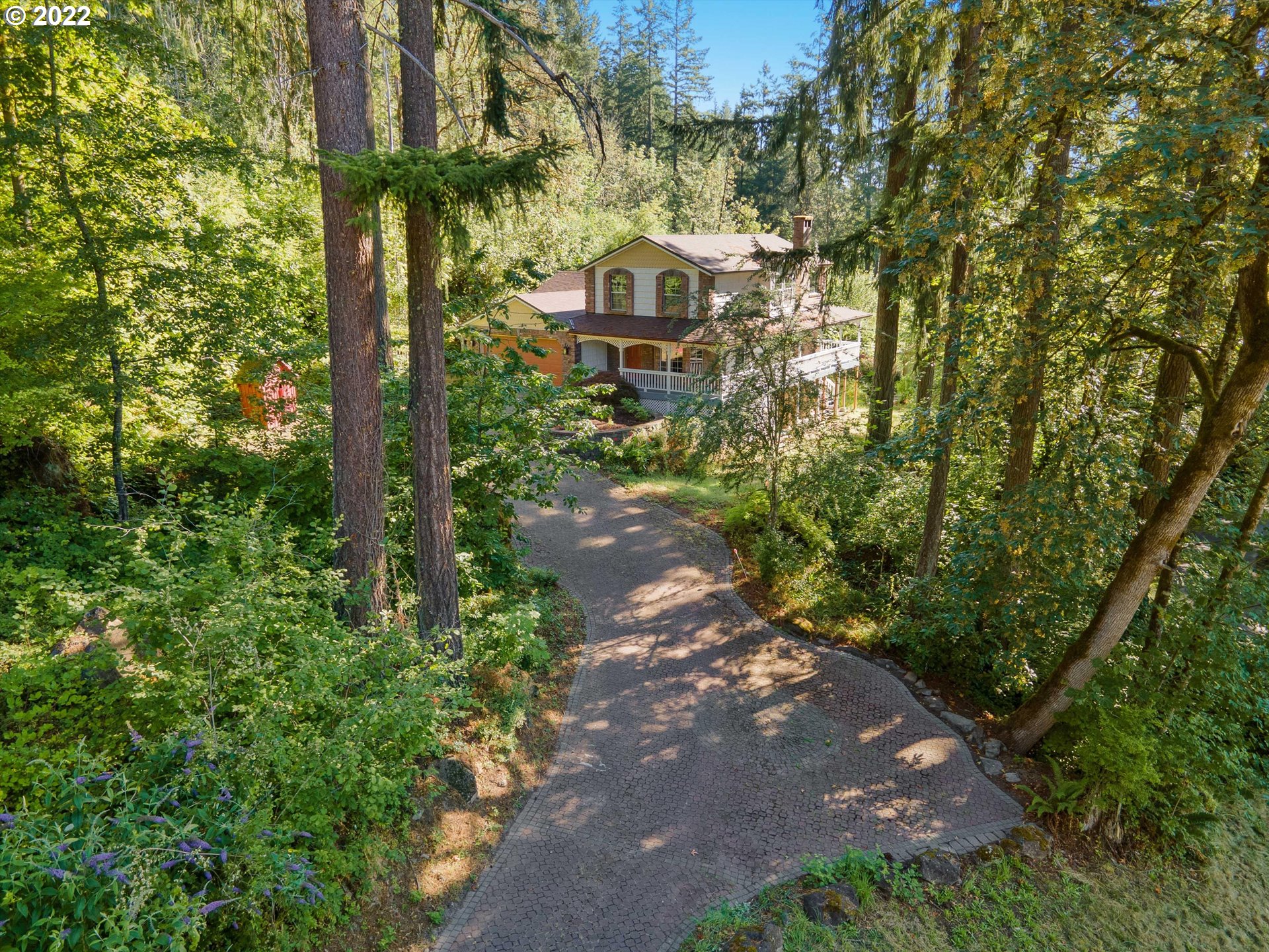 17212 Southeast Royer Road Damascus, OR 97089 - Photo 1 of 32 a view of a pathway with a tree in front of the house