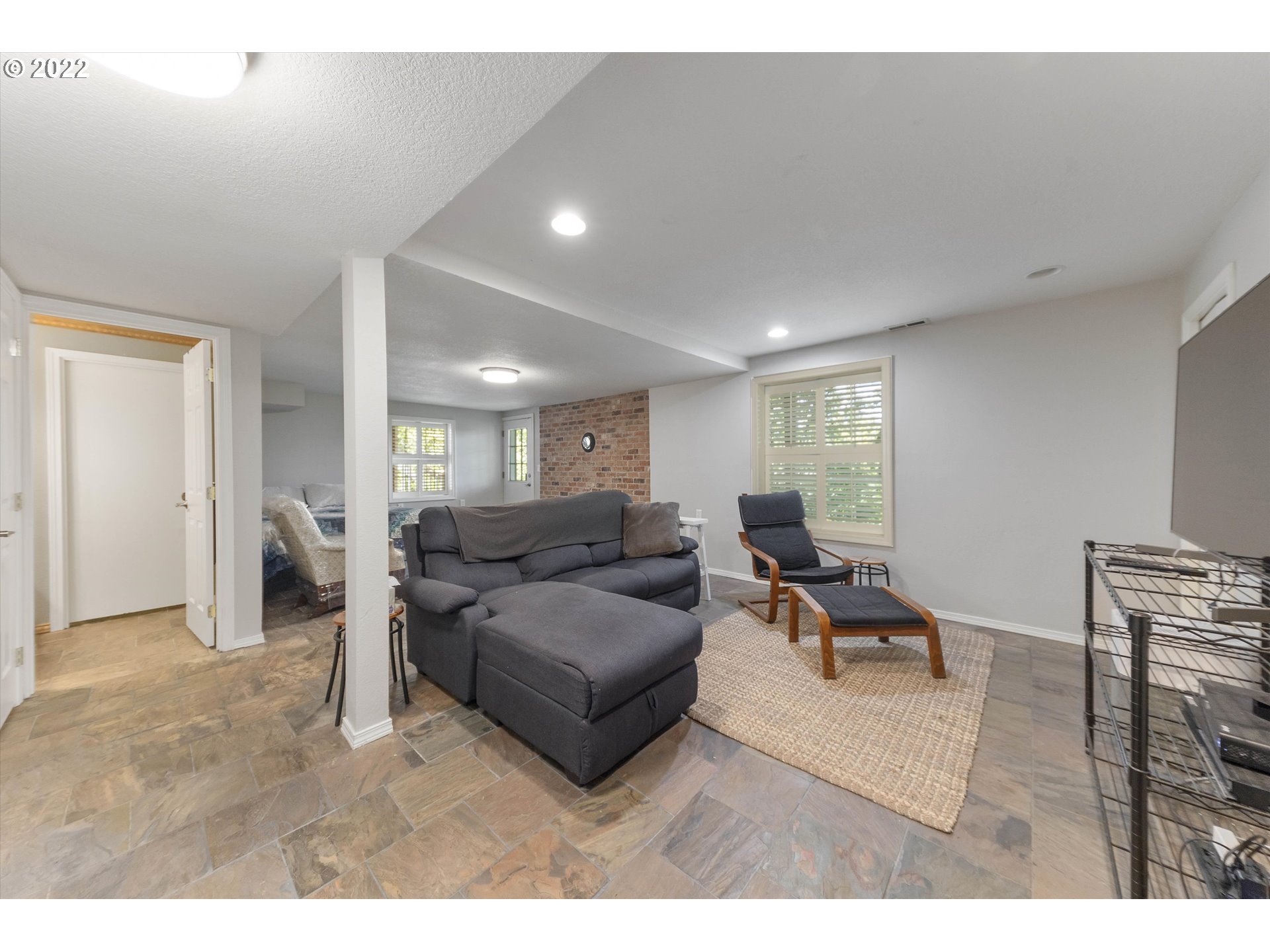 17212 Southeast Royer Road Damascus, OR 97089 - Photo 20 of 32 a living room with furniture and a wooden floor