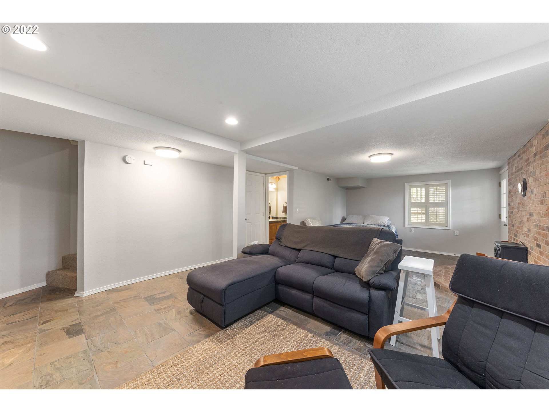 17212 Southeast Royer Road Damascus, OR 97089 - Photo 21 of 32 a living room with furniture and a window