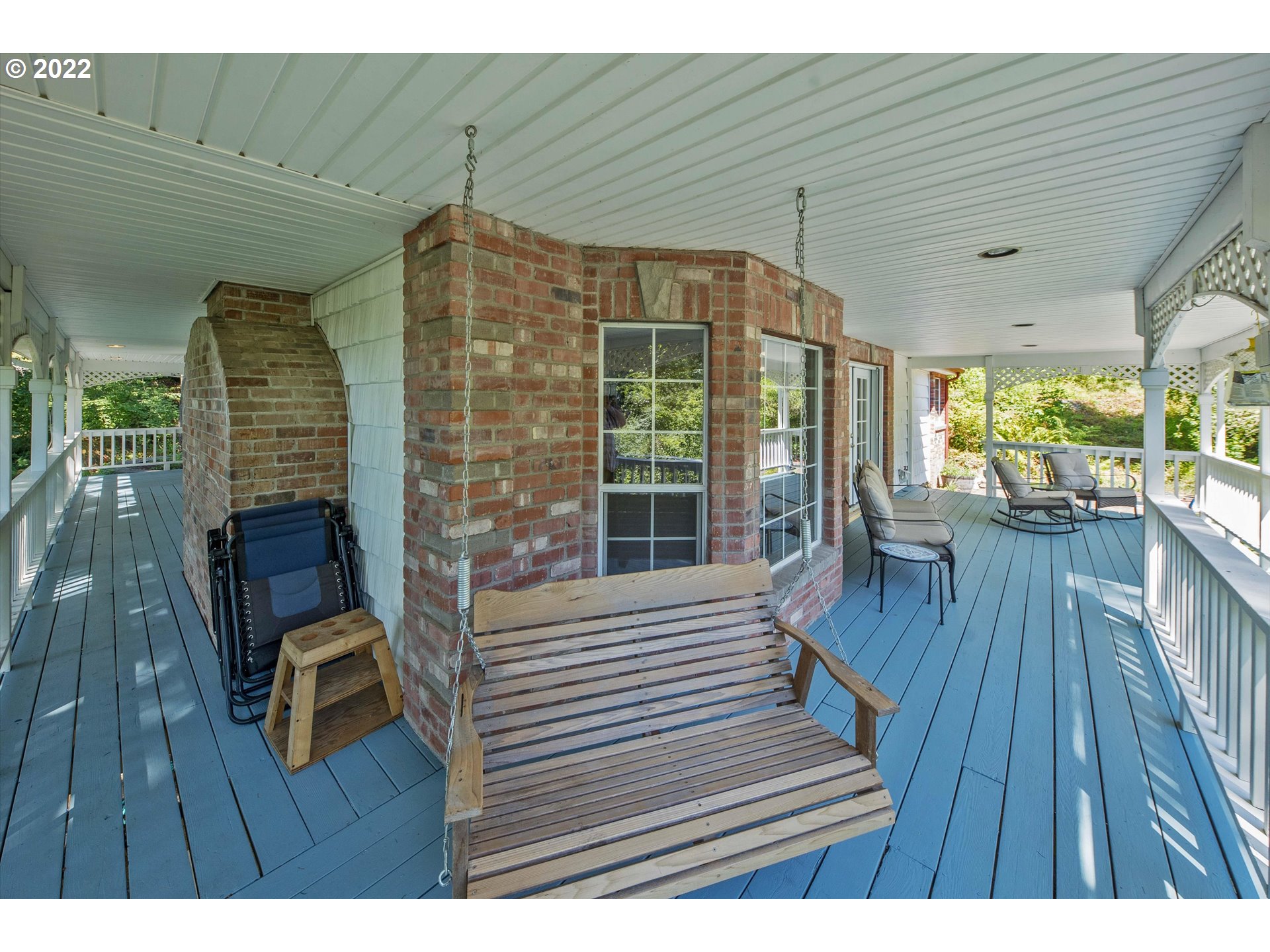 17212 Southeast Royer Road Damascus, OR 97089 - Photo 26 of 32 a view of a deck with dining table and chairs with wooden floor
