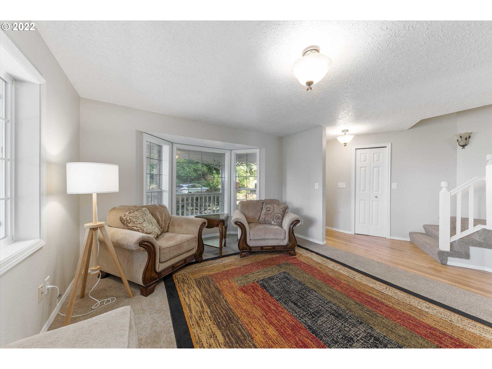 17212 Southeast Royer Road Damascus, OR 97089 - Photo 3 of 32 a living room with furniture and a window