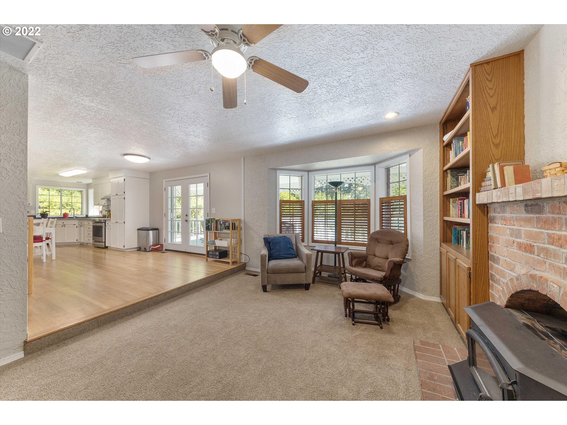 17212 Southeast Royer Road Damascus, OR 97089 - Photo 10 of 32 a living room with furniture and a chandelier