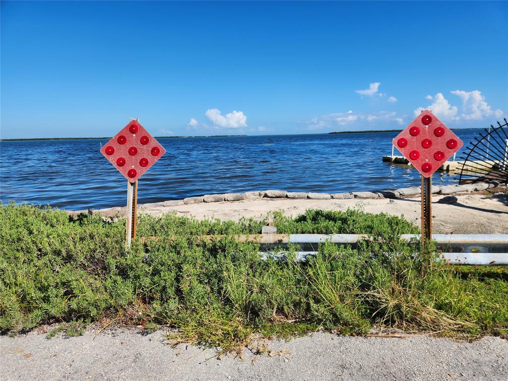31547 Ave D Big Pine Key, FL 33043 - Photo 11 of 42 a view of a table and chairs in a patio