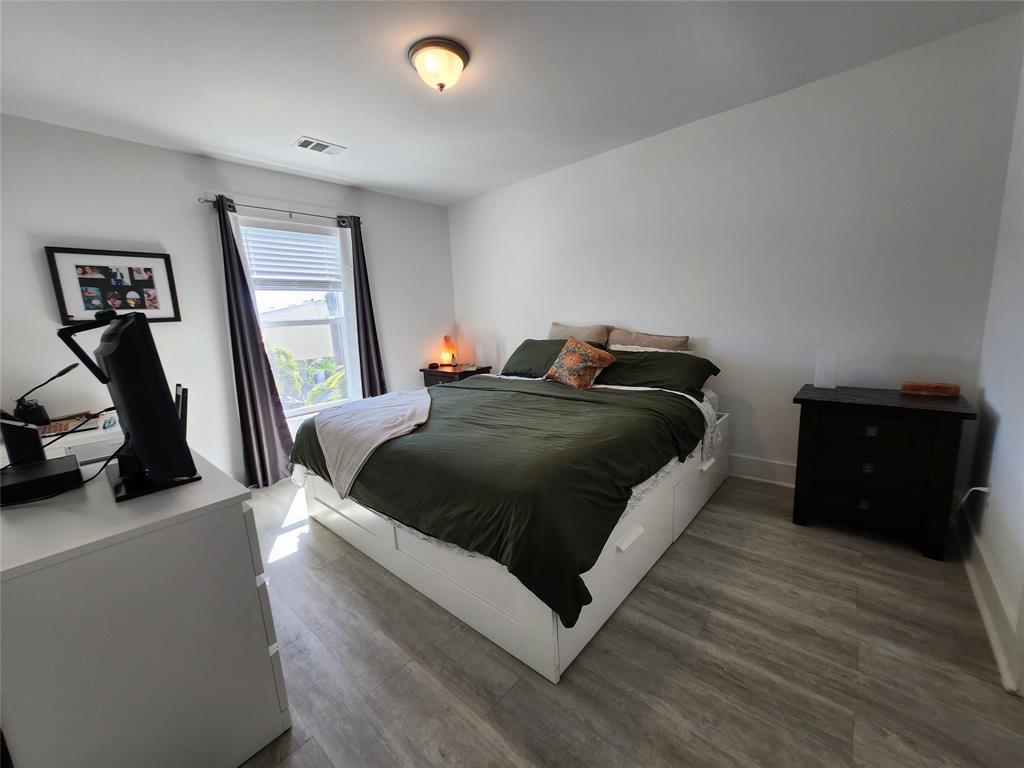 31547 Ave D Big Pine Key, FL 33043 - Photo 13 of 42 a bedroom with a bed and a couch