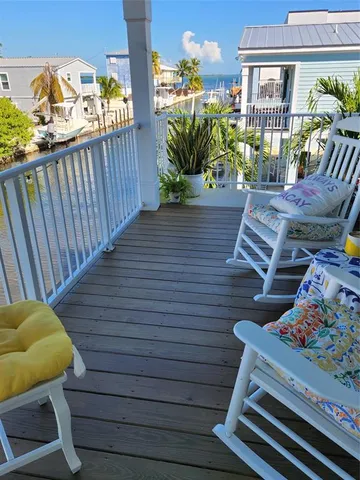 a view of a chairs on the roof deck