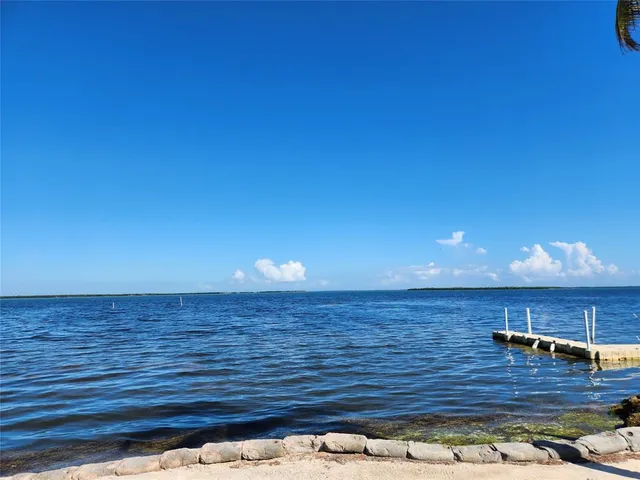 a view of a balcony with chairs
