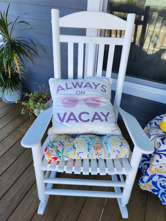 31547 Ave D Big Pine Key, FL 33043 - Photo 27 of 42 a table with potted plants and a bench